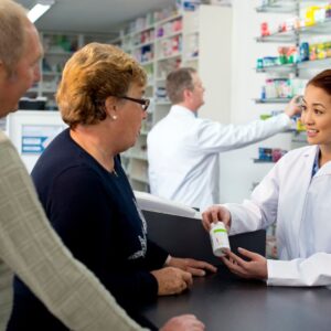 pharmacist presenting medication to patient